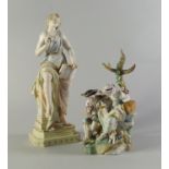 A Continental porcelain figure group of a man and woman, , he in floral jacket and breeches,