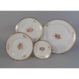 A Copenhagen part dinner service, decorated with sprays of brown and sepia flowers,