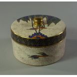 A Carltonware cylindrical powder jar and cover, 20th century, decorated and gilt with exotic birds.