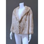 A palomino mink short jacket, labelled The Emporium, California,