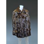 A long line mink jacket, Calman Links, London, with full sleeves and turn-back cuffs,