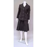 Diorling by Christian Dior: a black wool skirt and jacket suit, c.