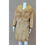 A fox fur coat, wide collar and revers,