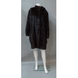 A dark brown mink long-line jacket with detachable hood, by Adolfo, New York,