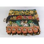 A collection of 19th century embroidered and beadwork runners, borders and bell pulls,