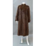 A mid brown full length collarless mink coat, by Grosvenor, for Harrods,