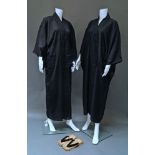 Two plain black Japanese men's kimonos, together with a blue and white cotton kimono,