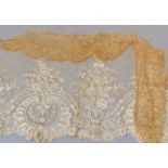 An antique lace panel, approx 160cm x 50cm, together with two further lace pieces.