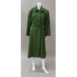 Christian Dior: an emerald green wool coat, concealed buttons and matching belt, size not labelled.