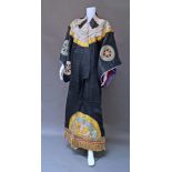 A rare Japanese Kabuki theatre costume, late 19th century, with appliqued symbols on a black ground,