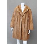 A Harrods pastel mink three-quarter length coat, generous collar and revers,