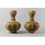 A pair of Zsolnay Pecs reticulated vases, 20th century, in the Islamic taste,