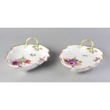 Two Meissen porcelain leaf shaped dishes, 19th century, with branch form handles, with gilt rims,