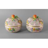 A pair of Herend porcelain pierced boxes and lids, 20th century, each with strawberry finial,