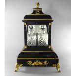 A French ebonised wood and gilt metal mounted decanter cabinet,