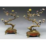 A pair of large and impressive bronzed metal and porcelain three light candelabra,