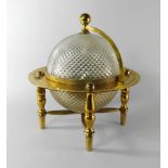 A Gubelin glass and gilt metal mystery clock, 20th century, in the form of a globe,