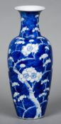 A Chinese blue and white vase
Decorated in the round in the Prunus Blossom pattern,