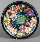 A modern Moorcroft pottery Carousel charger by Rachel Bishop
Signed, dated,
