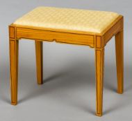 A satinwood veneered dressing stool
With drop-in seat.  51 cm wide.