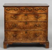 An 18th century walnut chest of drawers
The crossbanded rectangular top above an arrangement of