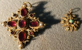 A 19th century unmarked gold filigree garnet and seed pearl set pendant 
Of crucifix form;