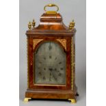 A George III walnut cased eight day repeating bracket clock
The arched silvered dial with strike