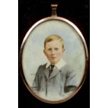 An unmarked yellow metal framed miniature portrait of a young boy
Monogrammed HW,