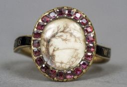 An 18th century unmarked gold and enamel mourning ring
Centred with a scenic view.