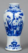 A Chinese blue and white porcelain vase
Decorated with figures in a garden.  22 cm high.