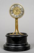 A 19th century verge pendulum clock
Of sunburst form, the dial centred with a religious scene,