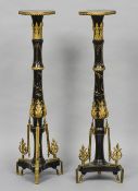A pair of 19th century ormolu mounted ebonised torcheres
Each circular top above an ormolu mounted