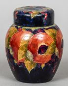 An early 20th century William Moorcroft pottery Pomegranate ginger jar and cover
Signed and