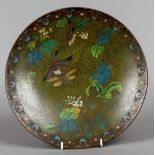 A Chinese cloisonne plate
Decorated with birds and insects amongst floral sprays.  30.5 cm diameter.
