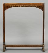 A Victorian mahogany billiard cue stand
The curved top rail above the cue clips with end trestle