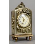 A miniature unmarked silver gilt carriage clock
The domed top surmounted with a nest of birds,
