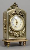 A miniature unmarked silver gilt carriage clock
The domed top surmounted with a nest of birds,