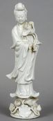 A Chinese blanc de chine figure of Guanyin
Typically modelled holding a lotus flower.  36.5 cm high.