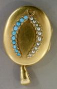 An unmarked high carat gold locket
Of large proportions,