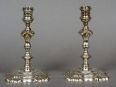 A pair of George II cast silver candlesticks, hallmarked London 1758,