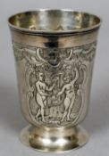 An 18th century Continental silver beaker
Engraved with a vignette of Adam and Eve.  10 cm high.