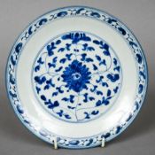 A 19th century Chinese blue and white dish
With scrolling floral decoration,