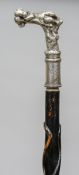 A Victorian walking stick
The ebonised shaft decorated with twin entwined serpents,