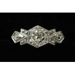 An Art Deco 9 ct gold and platinum three stone diamond ring CONDITION REPORTS: