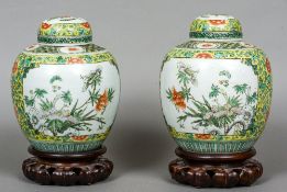 A pair of Chinese porcelain ginger jars
Each decorated with vignettes of insects amongst flowers,