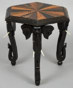 A 19th century Anglo-Indian specimen wood side table
The hexagonal shaped top inlaid with various