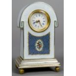 An enamel decorated silver desk clock
Of domed form,