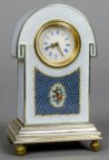 An enamel decorated silver desk clock
Of domed form,