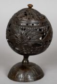 A 19th century carved and pierced coconut cup and cover
The main body carved with native figures