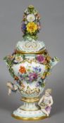 A Meissen porcelain lidded vase
The pierced lid with a florally encrusted finial,